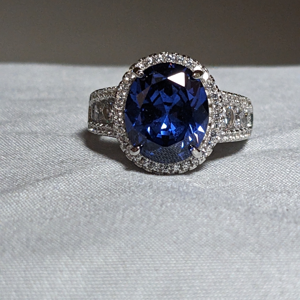 brand new tanzanite and white sapphire ring set in rhodium